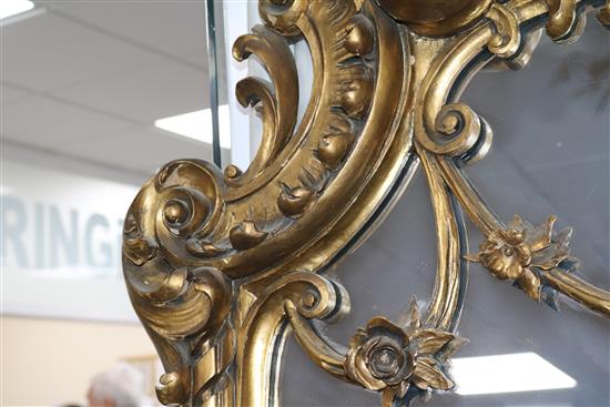 A large ornate giltwood wall mirror W.95cm